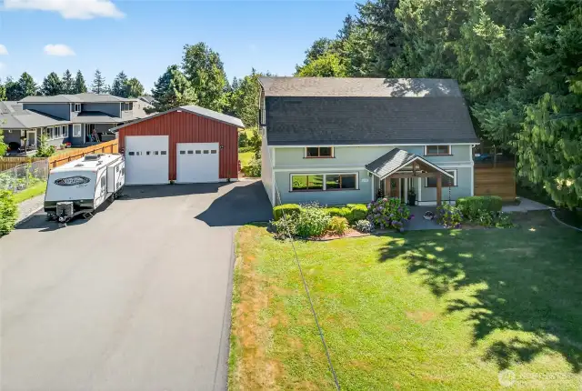 Low maintenance blacktop driveway with room for lots of parking.