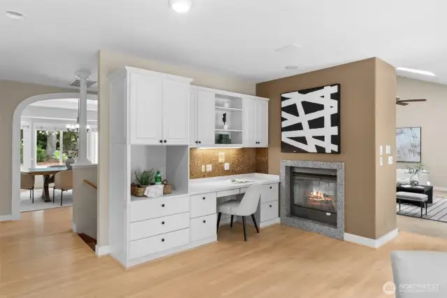 double sided fireplace. built in desk