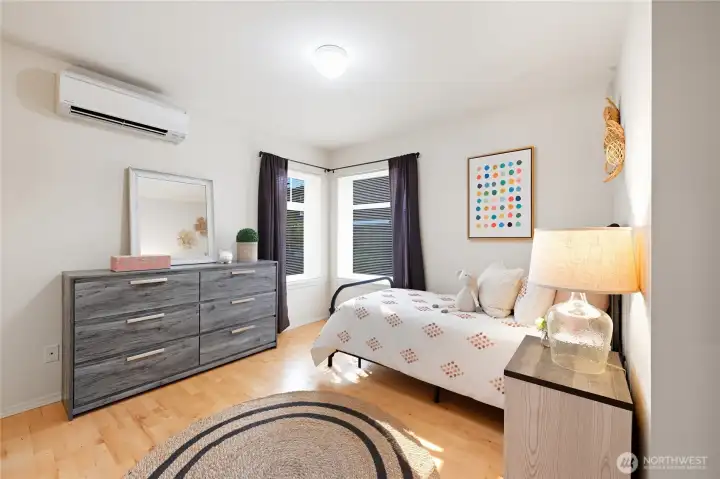 Mini-splits keep the entire home comfortable, here in bedroom 2. Forced air system in place, also.