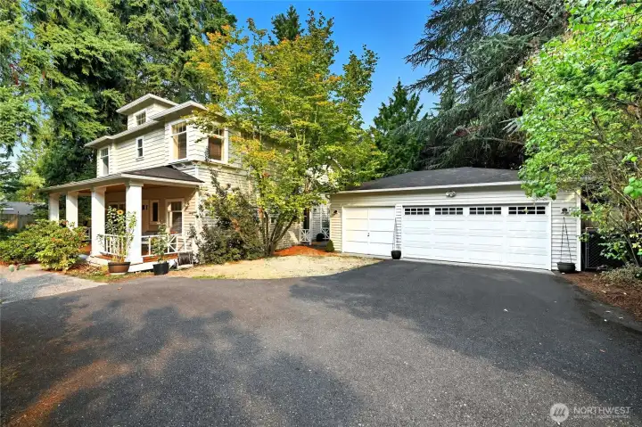 Three car detached garage. Bay 3 (left) has been used as a shop area. This paved area is at the end of the private entry lane.