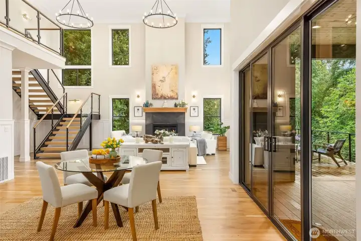 Triple height ceilings with matching hoop chandeliers. Generously proportioned windows all around capture abundant natural light