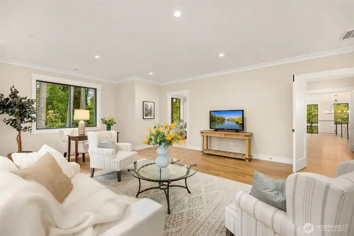 Media room: Double door entry, 5” wide oak floors, Dry bar with quartz countertop, and beverage cooler, Attached Jack and Jill bathroom
