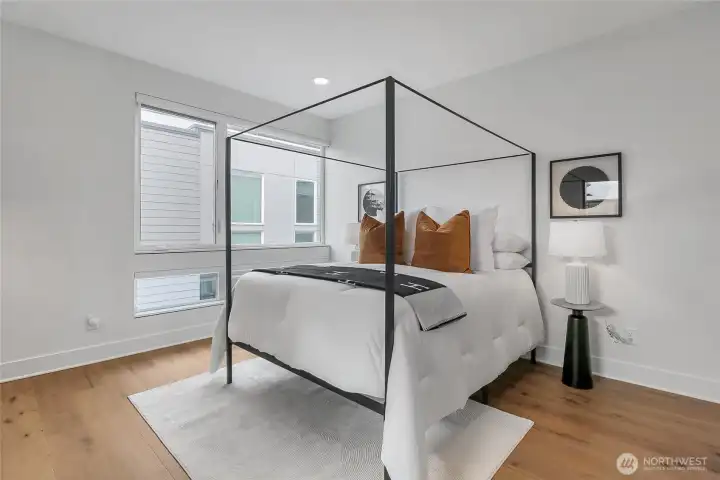 The primary suite blends privacy with natural light.