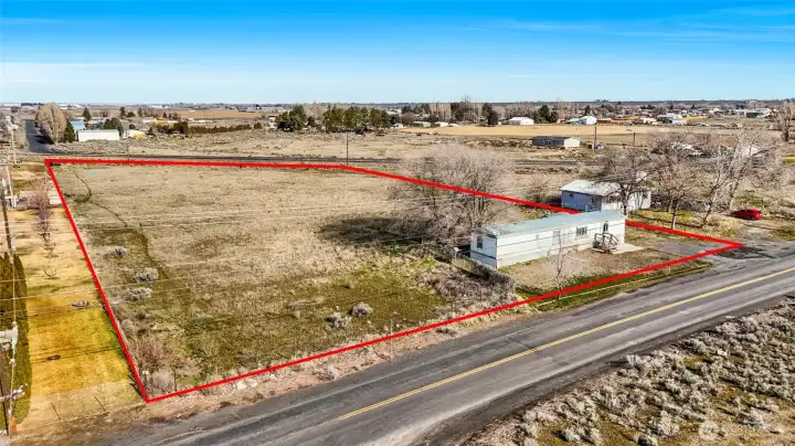 The red line depicts the boundary line for this property. Buyer to verify.