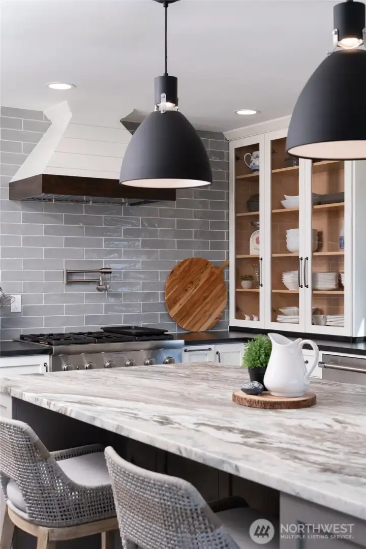 Leathered granite island with built-in cabinets
