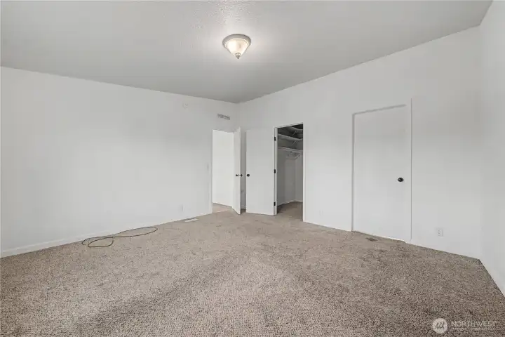 Primary Bedroom to the right