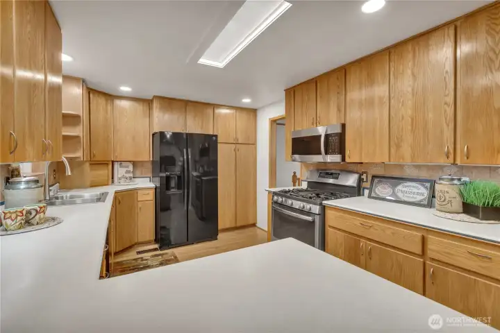 Custom cabinets with pullouts and a solid surface Corian style countertop...