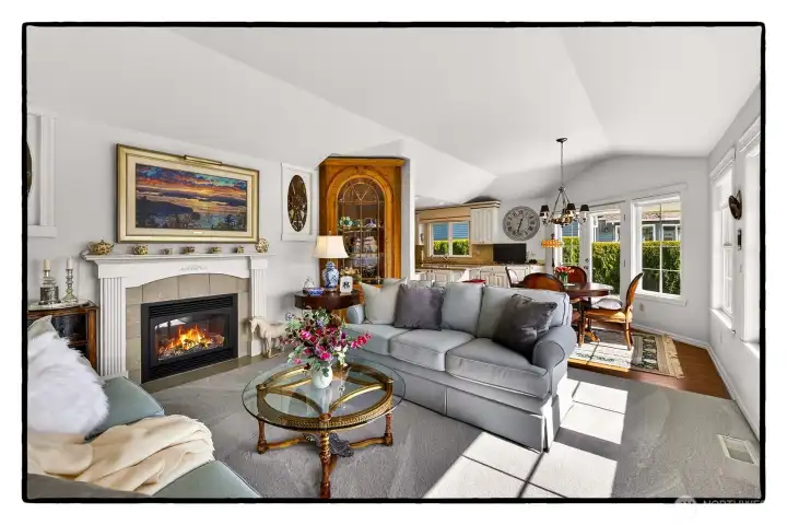 First living room with one of four gas fireplaces in the home