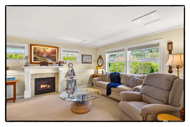 Second family room/den with one of four fireplaces in the home.