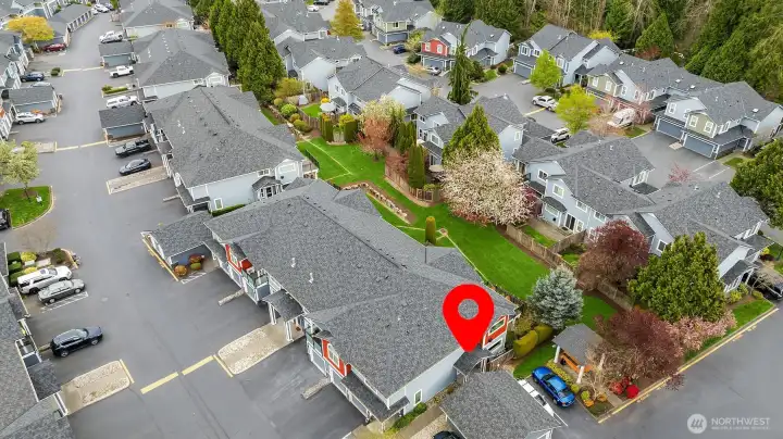 The front door is on the side of the building w/ covered front porch