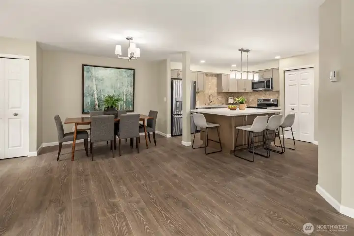 A nice size dining area off the kitchen and living room. Notice the new luxury vinyl plank flooring!  This brand new kitchen is absolutely wonderful. The larger island is the center piece!