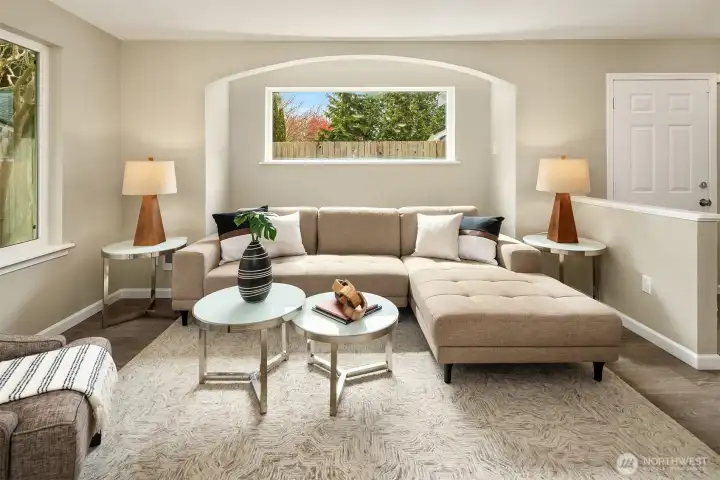 Notice the big windows in the front living room. Fresh interior paint throughout this house, new dual pane windows, and luxury vinyl plank flooring!
