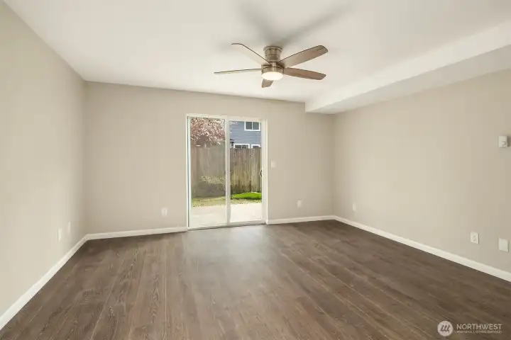 The primary bedroom view going out to the back patio