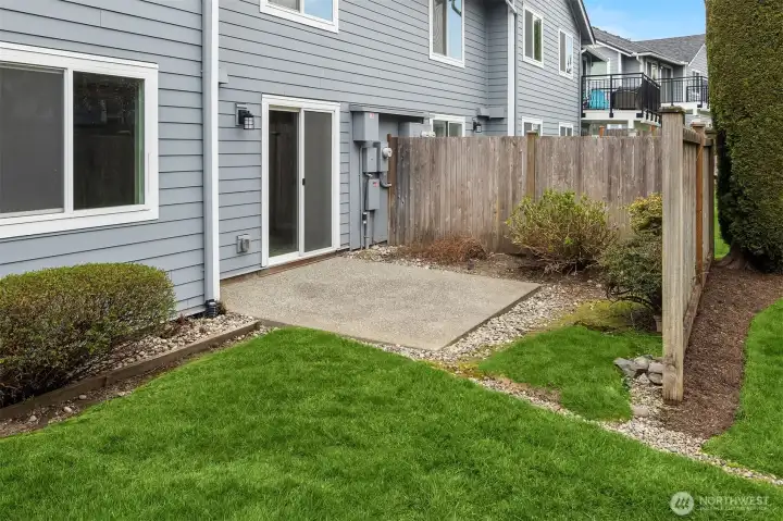 The back patio area off of the Primary Bedroom Suite. The entire complex has new siding, new paint, new dual pane vinyl windows, and new roofs several years ago.