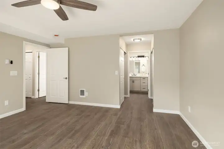 Primary Bedroom view looking into the updated bathroom and closets