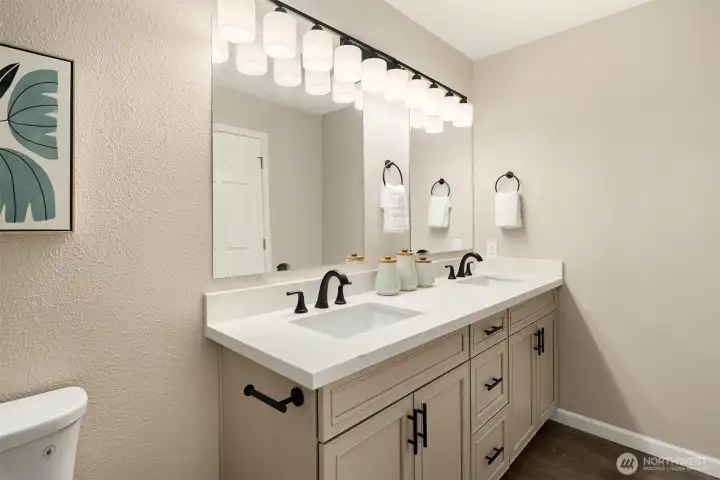 The updated sink area in the primary bathroom