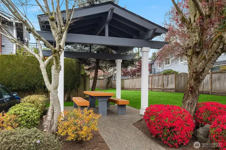A lovely covered picnic table and community lawn areas