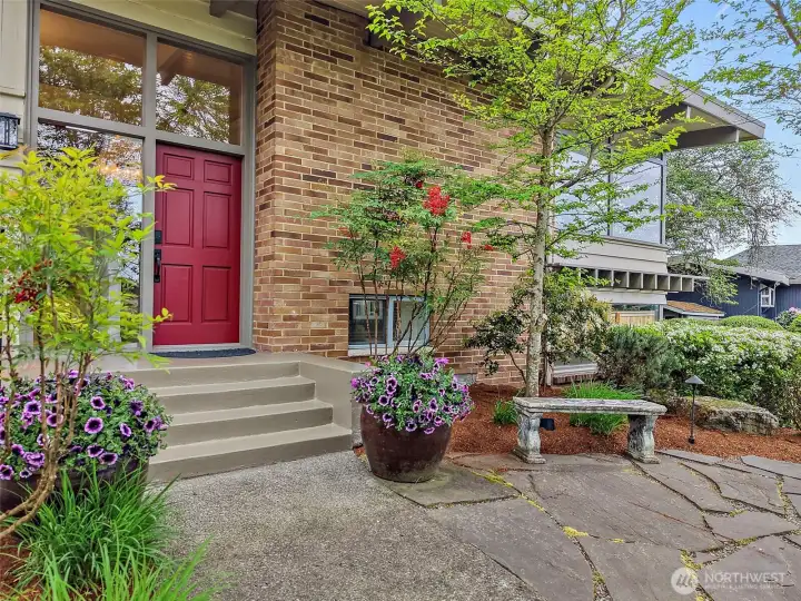 Inviting entry welcomes you with timeless architecture and mature landscaping.