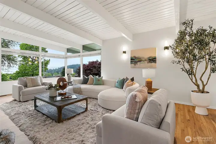 Light-filled living spaces showcase vaulted ceilings.