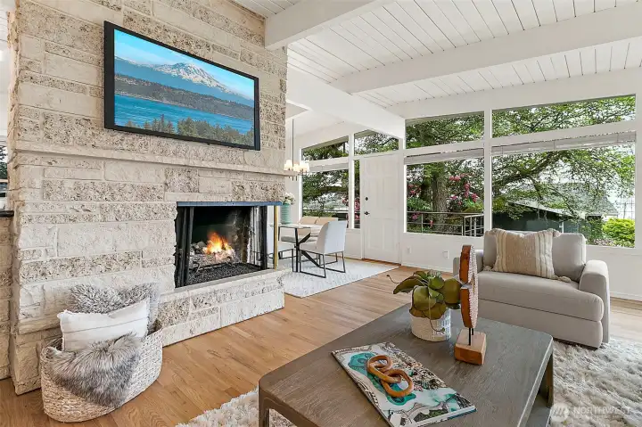 A shell stone gas fireplace anchors the main living room with warmth and character.