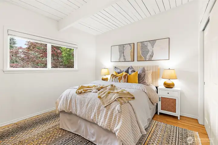 Comfortable third or guest bedroom offering warmth and versatility.