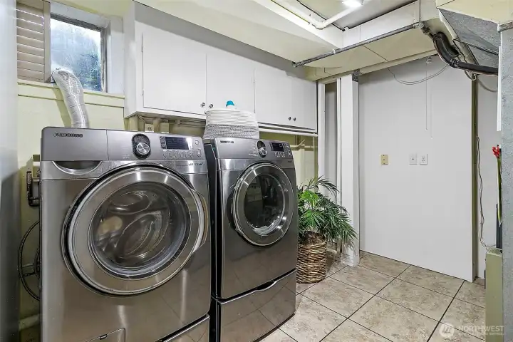 Spacious laundry room with Samsung washer and dryer.