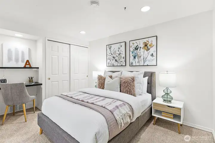 Lower level 4th bedroom or guest suite connected to additional living space.