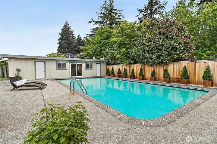 Sparkling in-ground pool creates the ultimate summer escape.