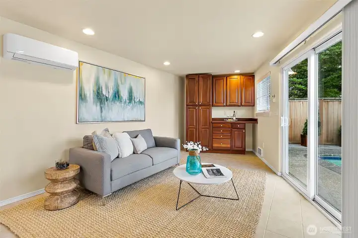 Studio overlooks the pool and expansive outdoor entertaining spaces.