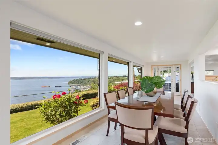 Dining area enjoys incredible views, and plenty of room to extend a table for large gatherings.