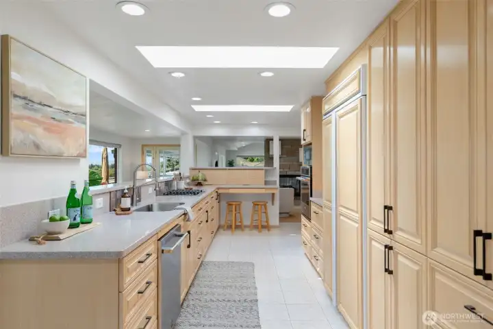 Kitchen has appliance garages, built-in refrigerator, and stores the whole house ISpring filtration system.