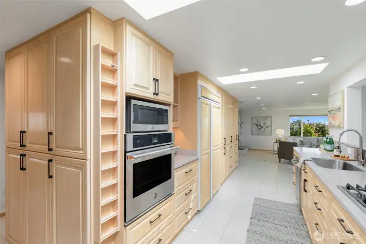 Built-in oven and microwave. Super workable kitchen in the center of everything.