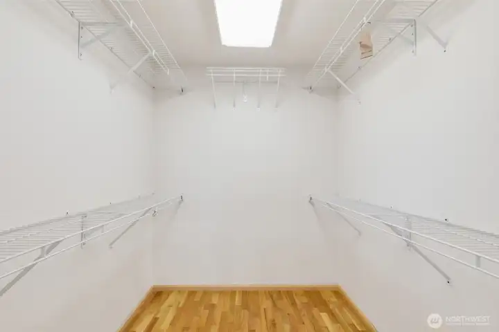 Walk-in closet in master bedroom.