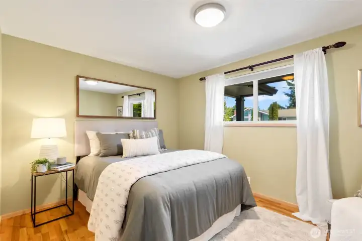 Second of three bedrooms. Easily accommodates a queen bed.