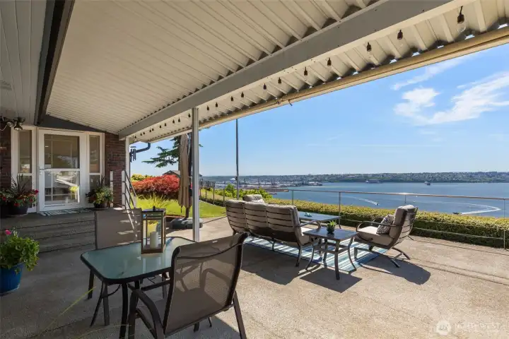 West facing view deck. Enjoy the full on sunshine or shade yourself under the awning. Patio also includes a hot tub. Back door is convenient to the kitchen when enjoying summer parties/bbqs.