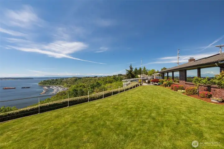 Back yard is perfectly manicured. All view windows have a UV coating so they diffuse the sun, and also are mirrored for privacy in the home. Entire yard front and back are on a sprinkler system.