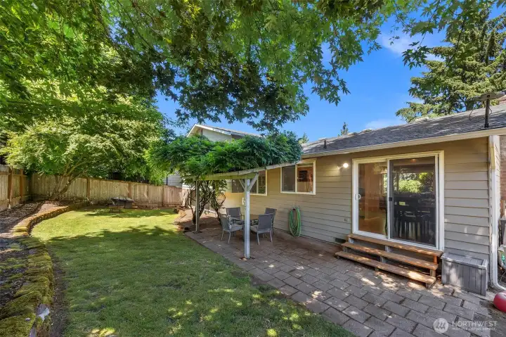 Fully fence backyard with covered patio space for family BBQs and fun filled evenings