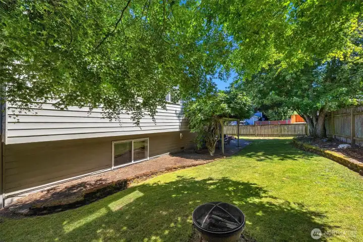 Backyard has enough space for a firepit, BBQ and yard games