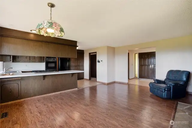 Laminate flooring allows for easy maintenance in the main living space.