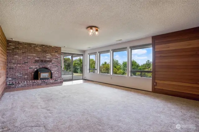 There are territorial as well as mountain views even from the basement level in this home. This room is a wonderful gathering place for games, etc. and has large windows to bring the natural light in.