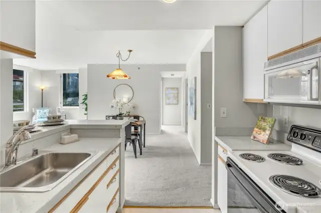 Kitchen view, looking towards living space and bedrooms.