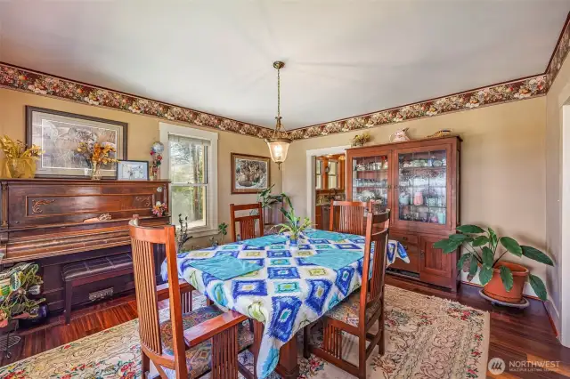 Dine with a view! The large windows in the dining room fill the space with natural light and frame scenic vistas—making every meal feel special.