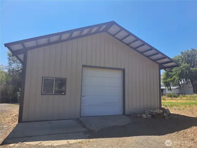 Spacious 30' x 45' shop with a large garage door—perfect for bringing in equipment to work on. Includes a 160 sq ft office and a wood stove to keep the space warm and comfortable year-round.