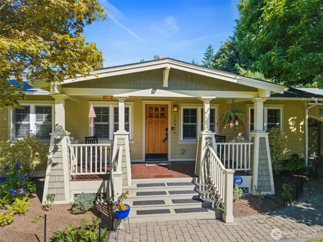 Covered front porch welcomes you and your guests in style.