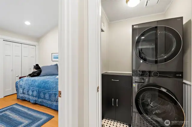 Laundry area is discretely located behind closed doors.