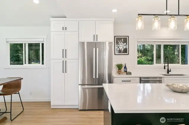 All stainless steel appliances with an abundance of cabinetry and flooded with natural light. Stunning!