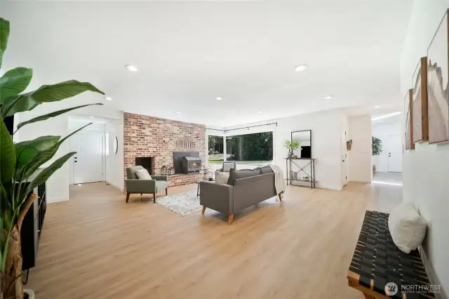 View looking from secondary bedroom hallway into main living area and note the additional entry. This split floor plan with primary seperated by main living area is very desirable.