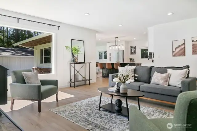 View from main living room to kitchen dining area. You will love the abundance of natural light.