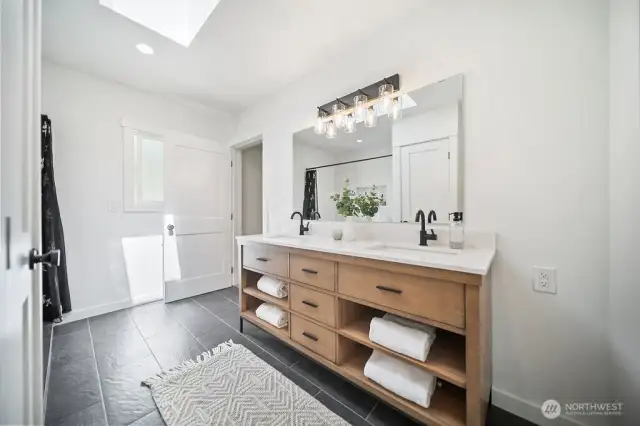 Primary ensuite featuring lovely slate flooring.