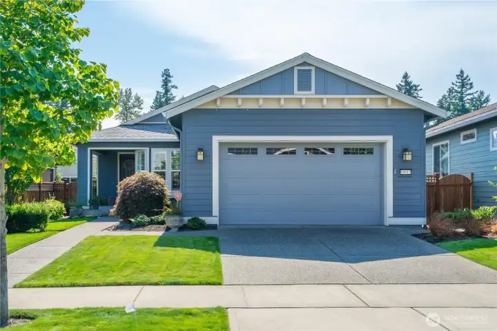 Charming street appeal welcomes you to this meticulously maintained popular "Monaco" home a short walk to the Lodge!